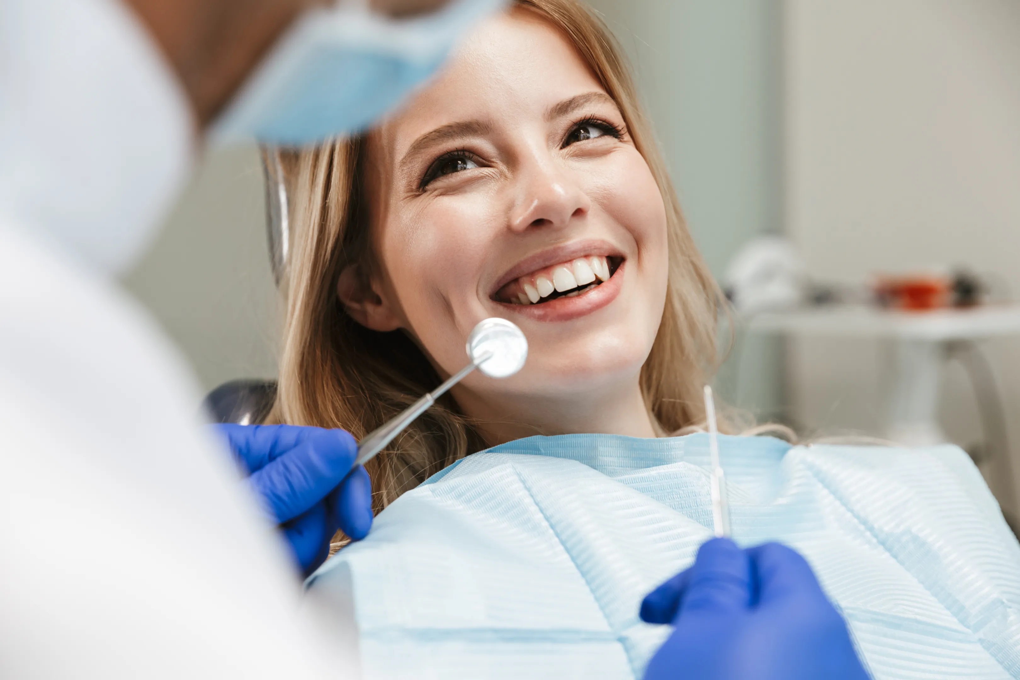 Happy patient during a routine dental checkup in Orange, CA