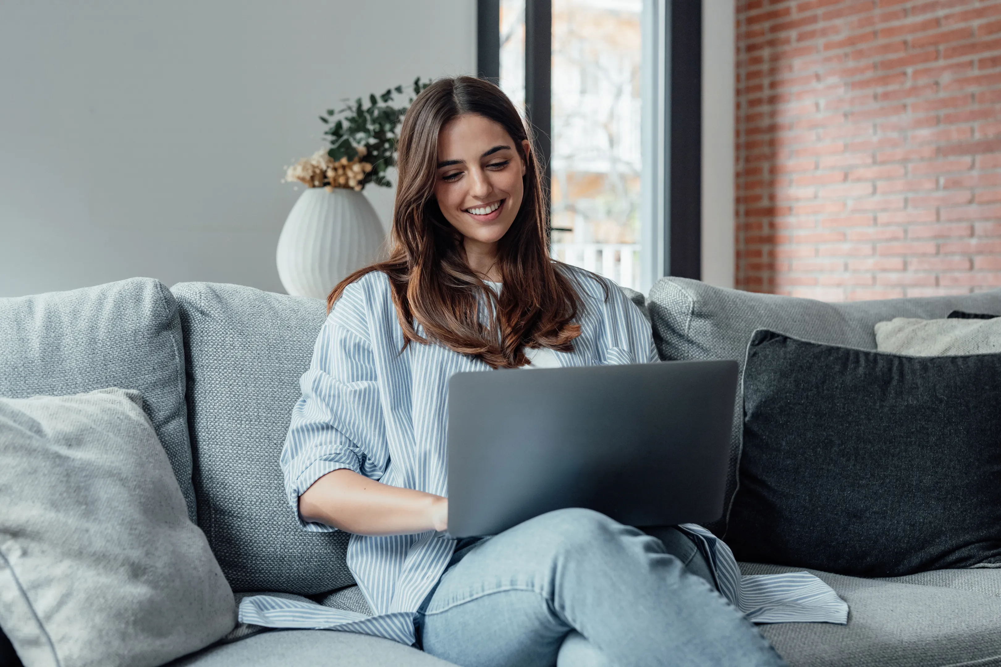 Person reading dental health articles at home