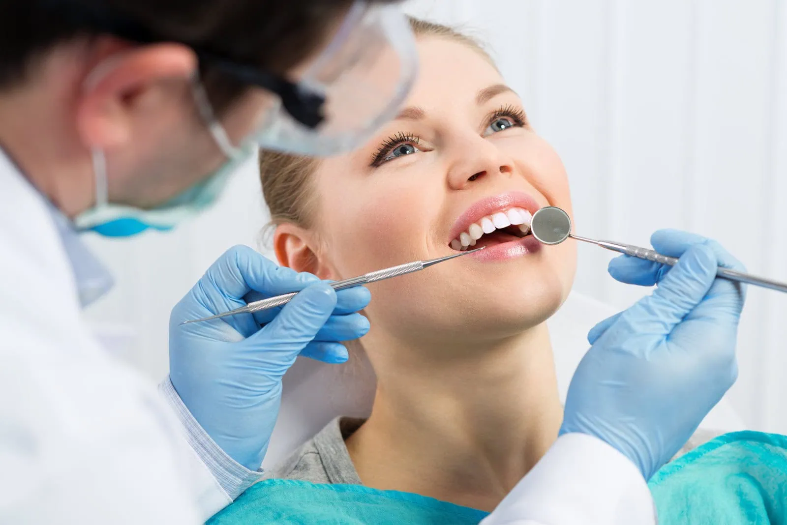 Dentist restoring a patient's smile at Glassell Dental