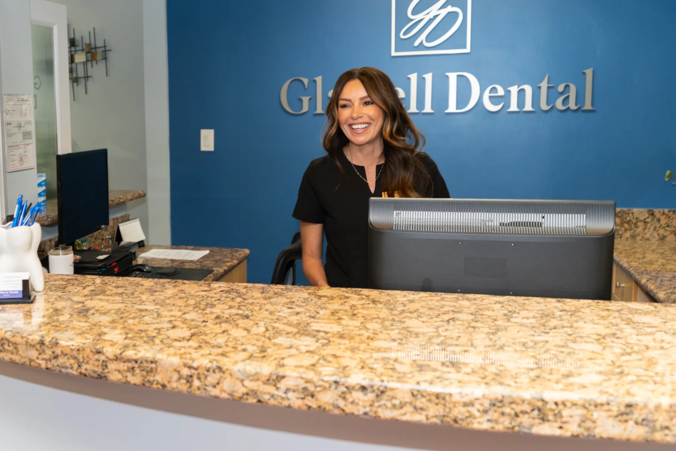 Glassell Dental front office team member at the reception desk
