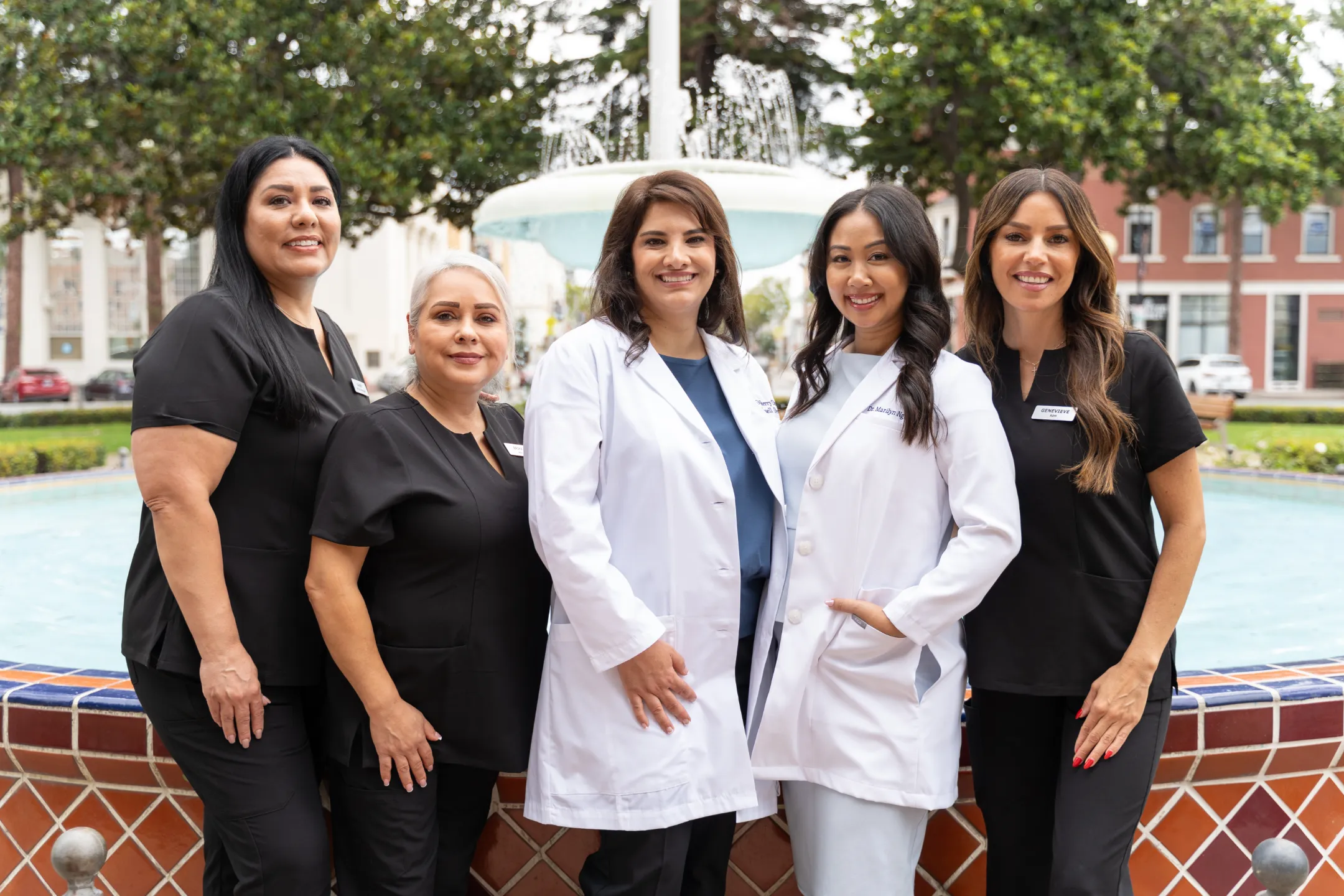 The Glassell Dental team together at the Orange Circle fountain